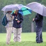 photo of spectators under umbrellas gallery at the 2022 Wells Fargo Championship with an 8 under par at TPC Potomac at Avenel Farms