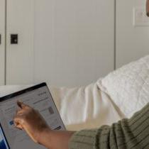 photo of woman working on a tablet